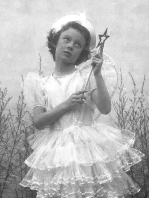 Kerrie Redgate dressed as a fairy with a star wand | age 7